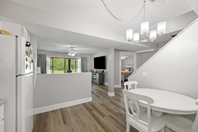 429 Sneaking Creek Dr, Hayesville, NC 28904 - dining space with a ceiling fan, wood finished floors, baseboards, and a chandelier