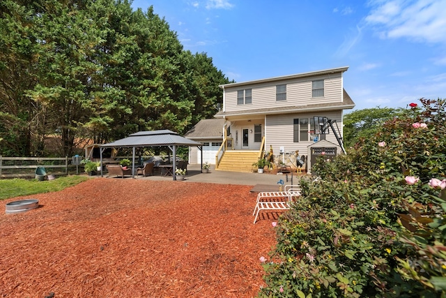 429 Sneaking Creek Dr, Hayesville, NC 28904 - view of front facade featuring a gazebo, a patio area, and a detached carport