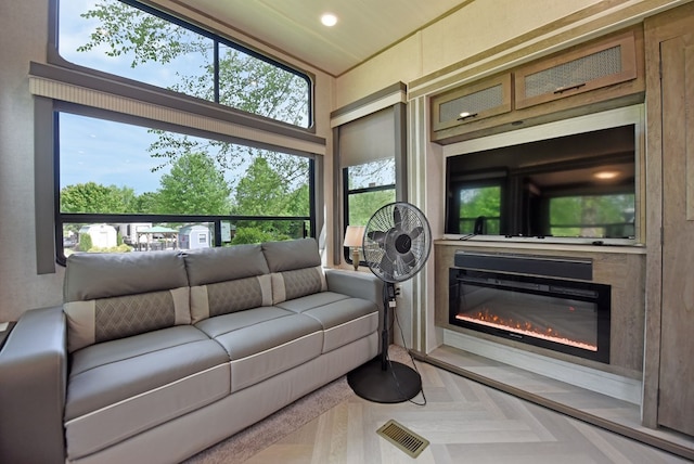 201 Kole Dr, Blairsville, GA 30512 - living room with healthy amount of natural light, a glass covered fireplace, and recessed lighting