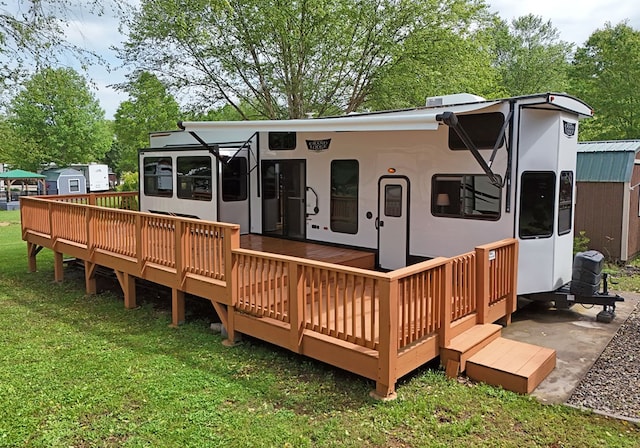 201 Kole Dr, Blairsville, GA 30512 - back of property with a sunroom, a wooden deck, and a yard
