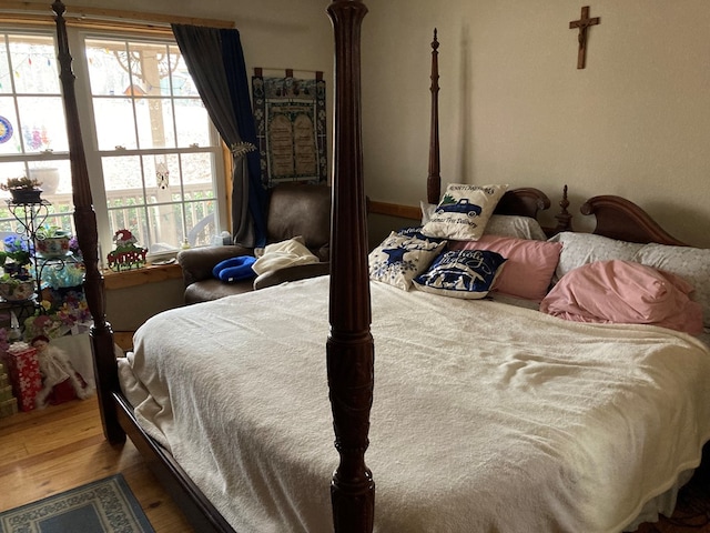 bedroom with wood-type flooring