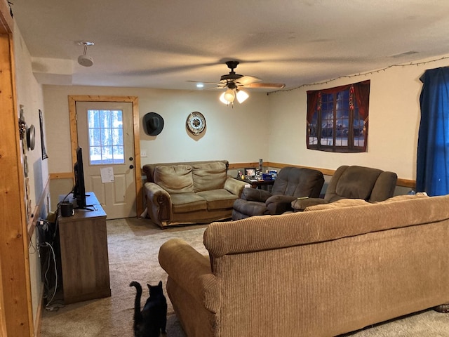 living room featuring ceiling fan and light carpet