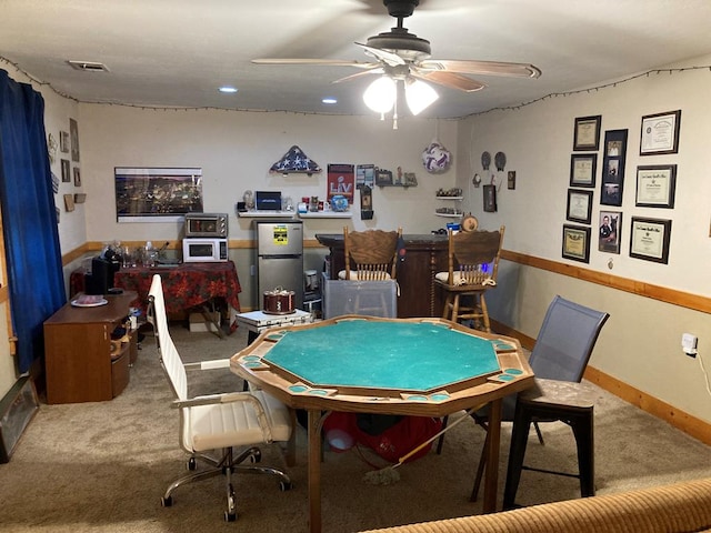 game room with carpet and ceiling fan