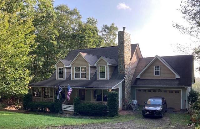 view of front of house with covered porch and a garage