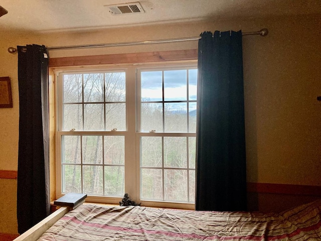 unfurnished bedroom with multiple windows