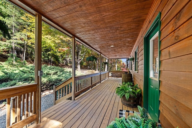 wooden terrace with a porch