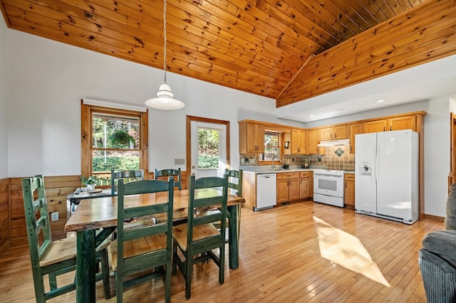 kitchen featuring light hardwood / wood-style flooring, decorative light fixtures, white appliances, and wood ceiling