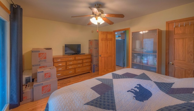 bedroom featuring ceiling fan and light wood-type flooring