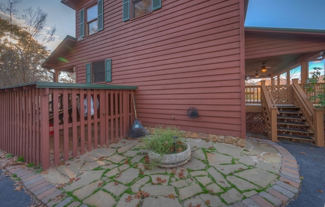 view of side of home with a wooden deck