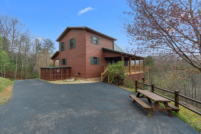 view of property exterior with driveway