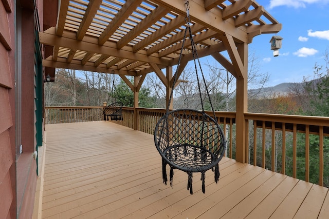 deck with a mountain view and a pergola