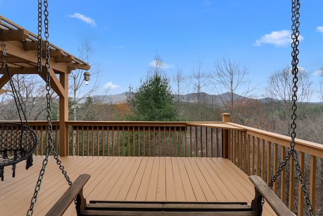 wooden deck featuring a mountain view