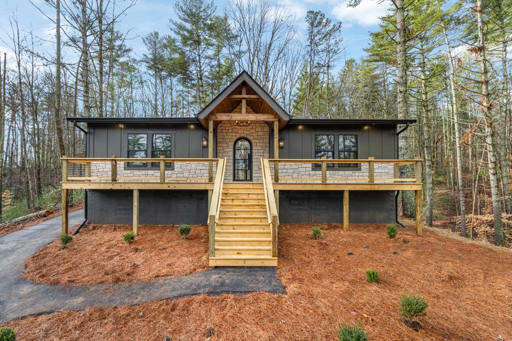 view of front facade with a wooden deck