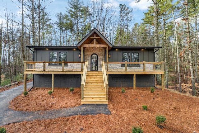 view of front facade with a wooden deck