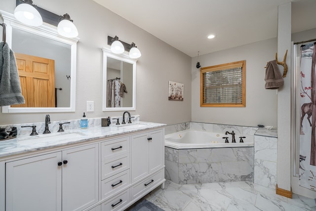 bathroom with a garden tub, double vanity, a sink, and marble finish floor