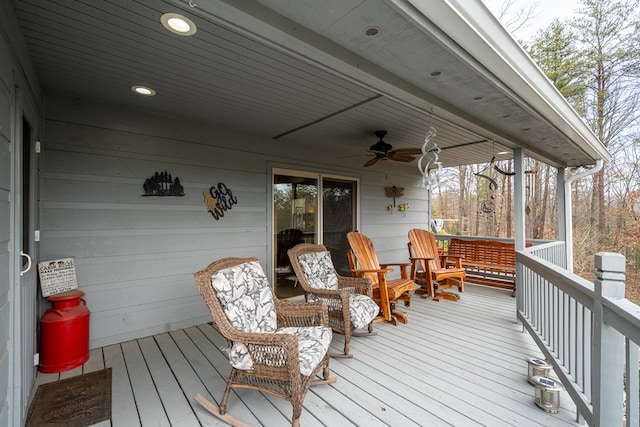 wooden terrace featuring ceiling fan