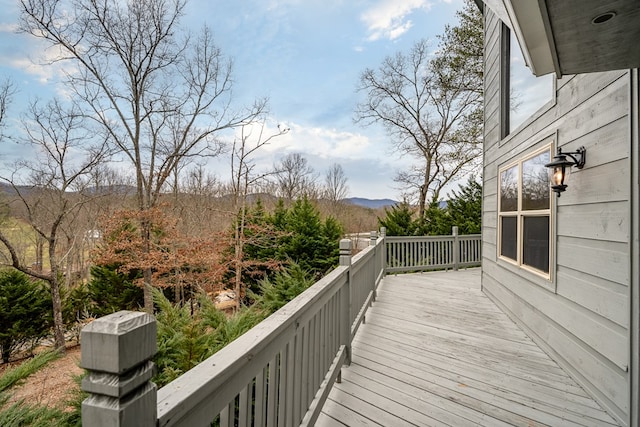 wooden terrace with a mountain view