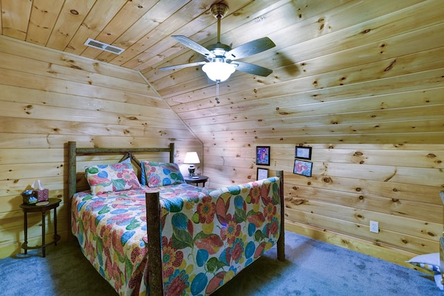 bedroom featuring carpet flooring, ceiling fan, wooden ceiling, wood walls, and vaulted ceiling