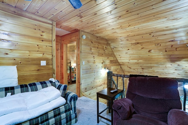 bedroom featuring carpet, lofted ceiling, wooden walls, and wood ceiling