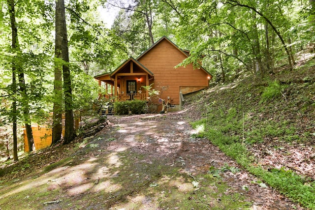 view of property exterior featuring a porch