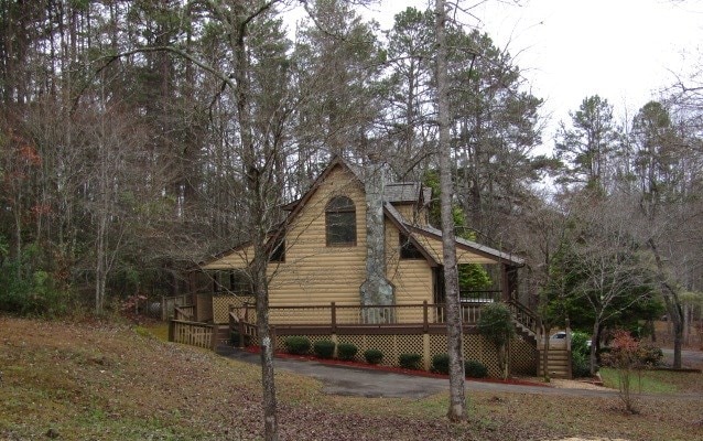 view of side of property with a wooden deck