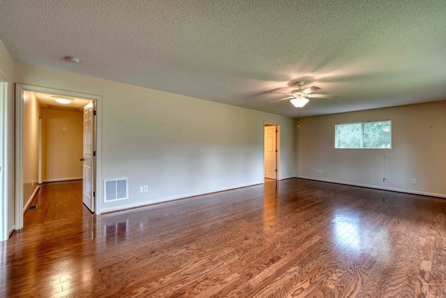 spare room featuring a textured ceiling, ceiling fan, and hardwood / wood-style flooring