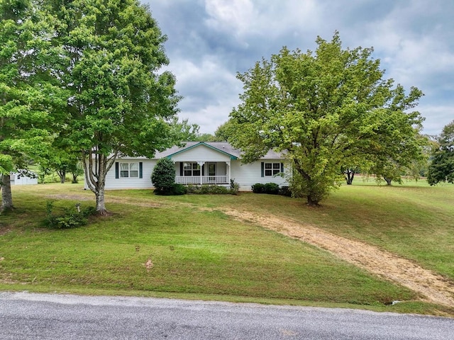 ranch-style home with a porch and a front yard