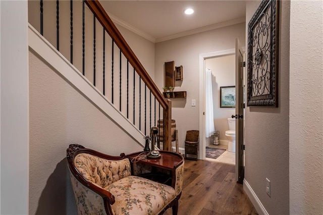 foyer featuring baseboards, dark wood finished floors, stairway, ornamental molding, and recessed lighting