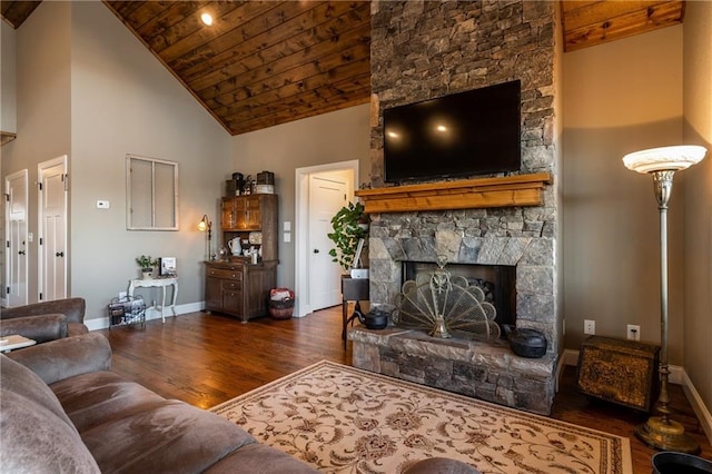 living area featuring wooden ceiling, baseboards, a fireplace, and dark wood-style floors