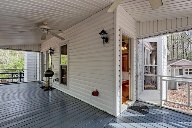 deck featuring central AC unit and a ceiling fan