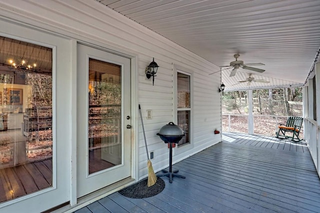 wooden terrace featuring ceiling fan