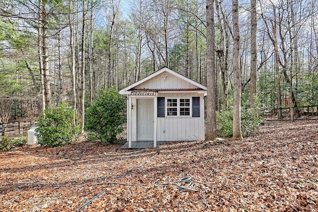 view of outbuilding with an outbuilding and a wooded view