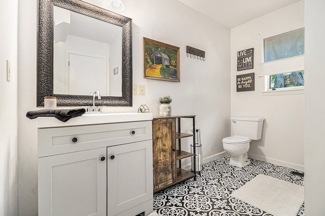 147 Hester Gap Rd, Cleveland, GA 30528 - bathroom featuring baseboards, toilet, vanity, and tile patterned flooring
