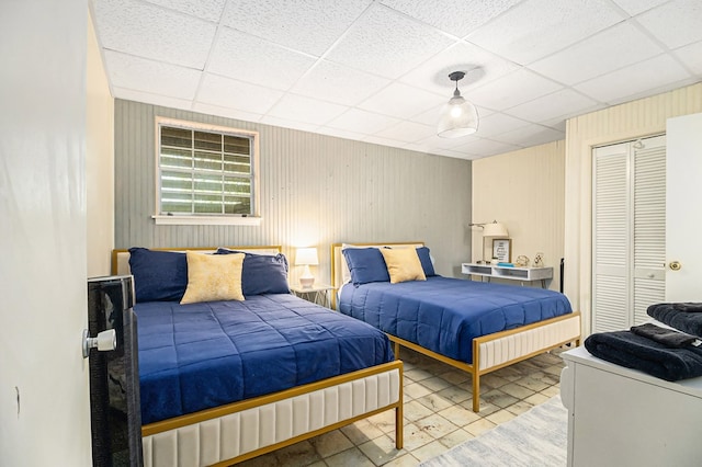 147 Hester Gap Rd, Cleveland, GA 30528 - tiled bedroom with a drop ceiling, a closet, and wooden walls