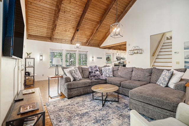 147 Hester Gap Rd, Cleveland, GA 30528 - living room with wood ceiling with exposed beams, wood-type flooring, high vaulted ceiling, stairway, and a chandelier
