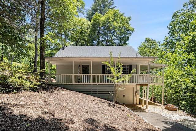 147 Hester Gap Rd, Cleveland, GA 30528 - view of front of house with a porch, driveway, an attached garage, and a shingled roof