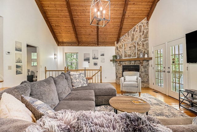 147 Hester Gap Rd, Cleveland, GA 30528 - living area with high vaulted ceiling, wooden ceiling with exposed beams, hardwood / wood-style flooring, healthy amount of natural light, and a chandelier