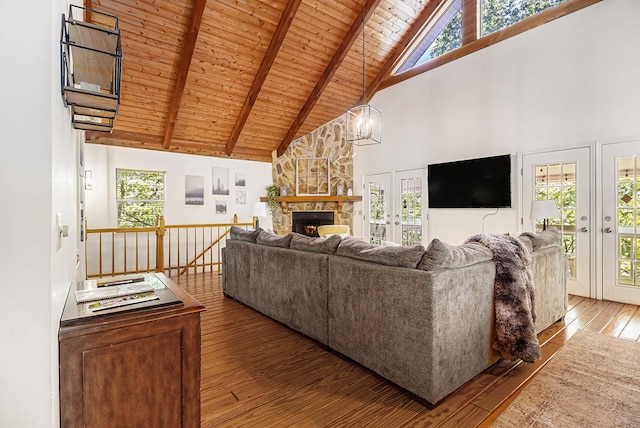 147 Hester Gap Rd, Cleveland, GA 30528 - living area with high vaulted ceiling, hardwood / wood-style floors, a fireplace, wooden ceiling with exposed beams, and plenty of natural light