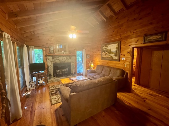 135 Tomahawk Trl, Blue Ridge, GA 30513 - living area with hardwood / wood-style floors, wood ceiling with exposed beams, wood walls, a stone fireplace, and ceiling fan