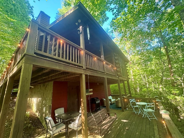 135 Tomahawk Trl, Blue Ridge, GA 30513 - back of property with a wooden deck and a chimney