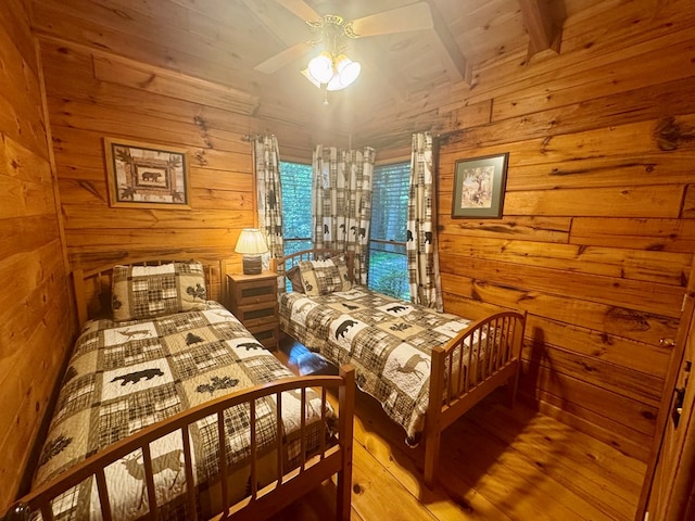 135 Tomahawk Trl, Blue Ridge, GA 30513 - bedroom featuring wooden walls, wood finished floors, and a ceiling fan