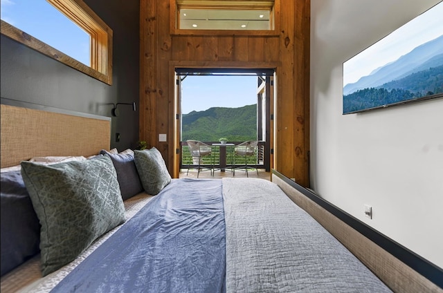 bedroom featuring a mountain view