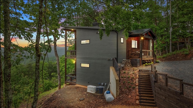 property exterior at dusk with central air condition unit