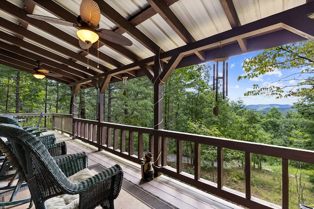 wooden deck featuring ceiling fan