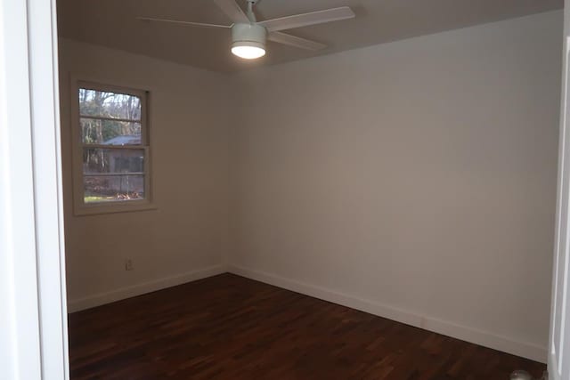 empty room featuring dark hardwood / wood-style floors and ceiling fan