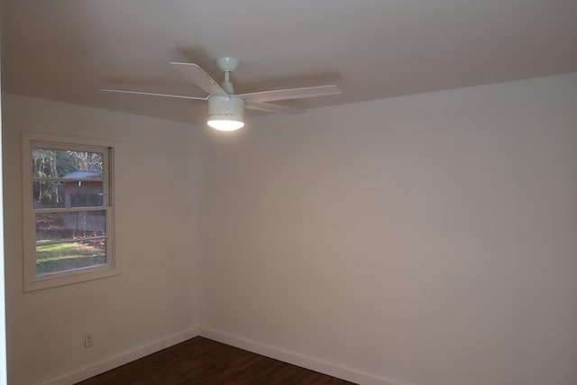 empty room featuring ceiling fan and dark hardwood / wood-style floors