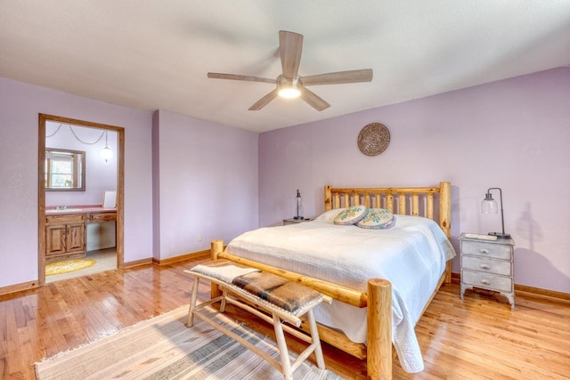 bedroom with ceiling fan, sink, ensuite bathroom, and light wood-type flooring