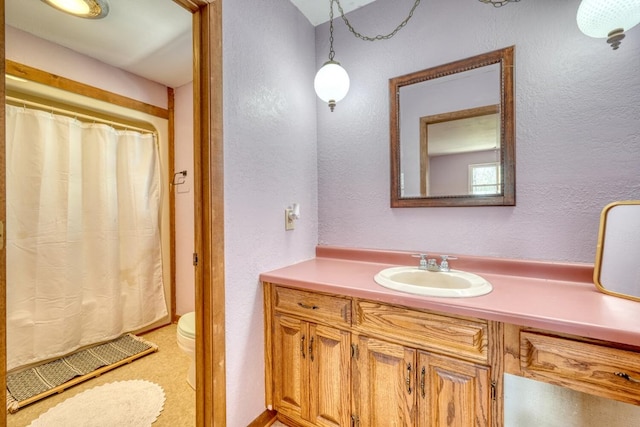 bathroom with vanity and toilet