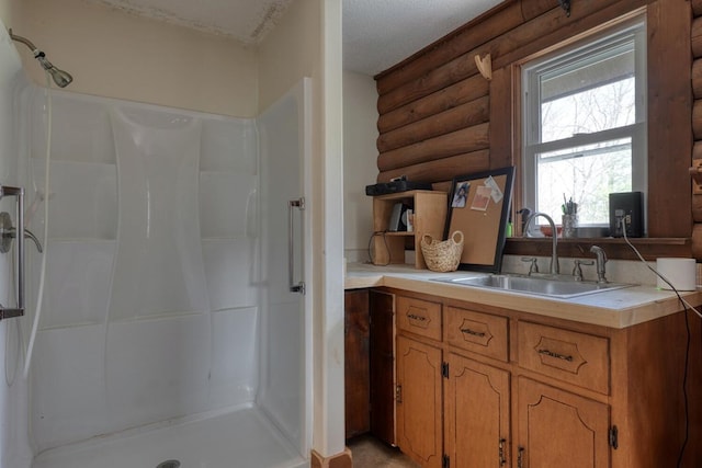 bathroom with a shower, sink, and log walls