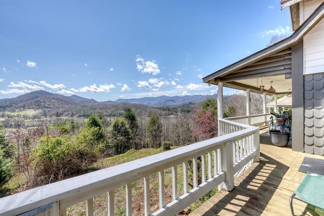 wooden deck featuring a mountain view